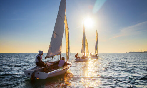 Nice,View,Of,The,Sailboats,In,The,Sunset,Leaving